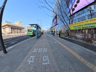Shared pedestrian and bicycle sidewalk in Gwanghwamun with clear lane markings